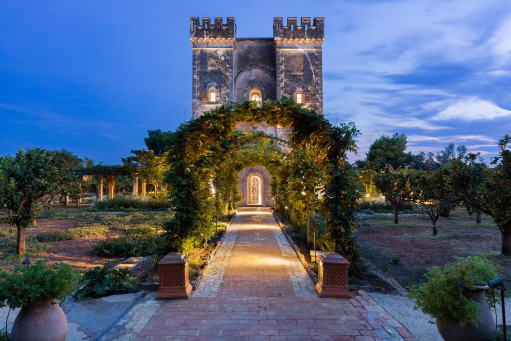 A lush archway beckons guests to explore and unwind. Le Grand Jardin