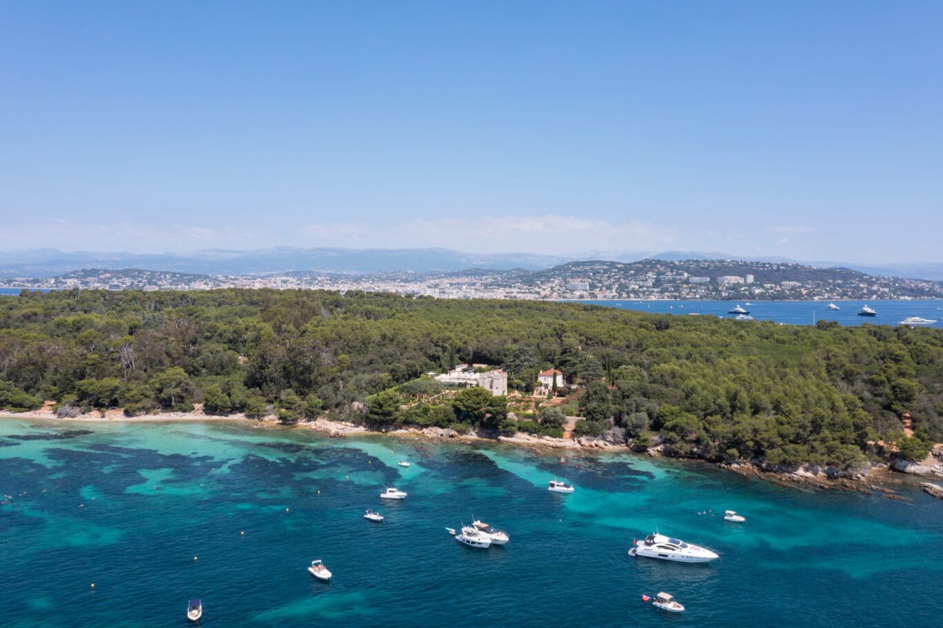 Boat-dotted waters surrounded the luscious Le Grand Jardin, Cannes