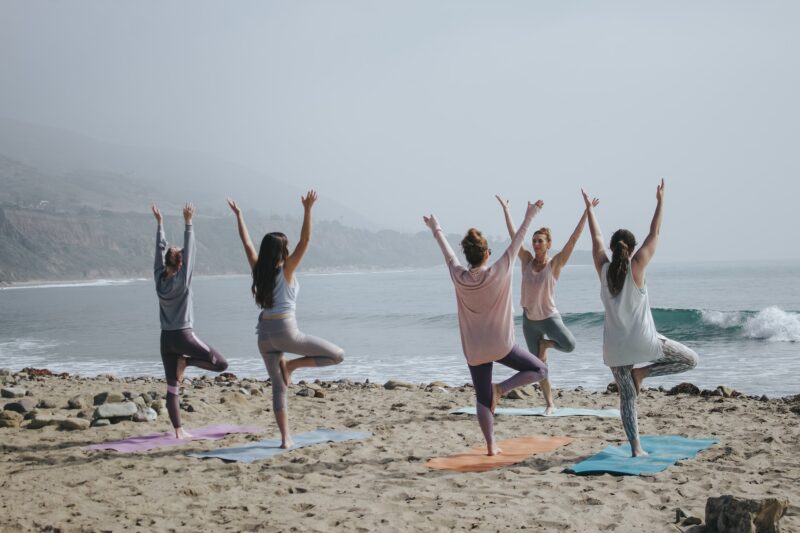 Yoga on beach retreat luxury