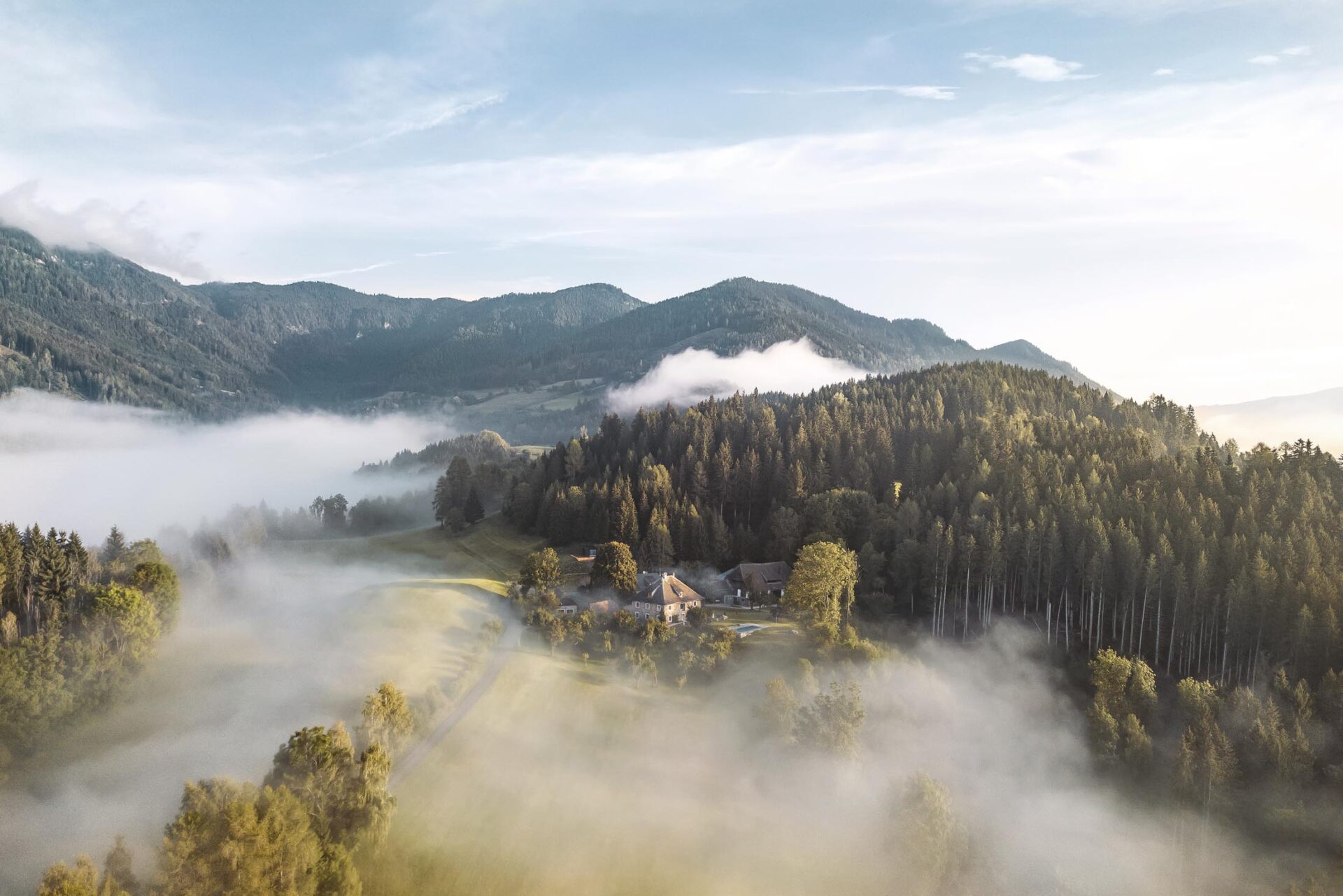 Aerial image of hidden private estate in Austria surrounded by forest