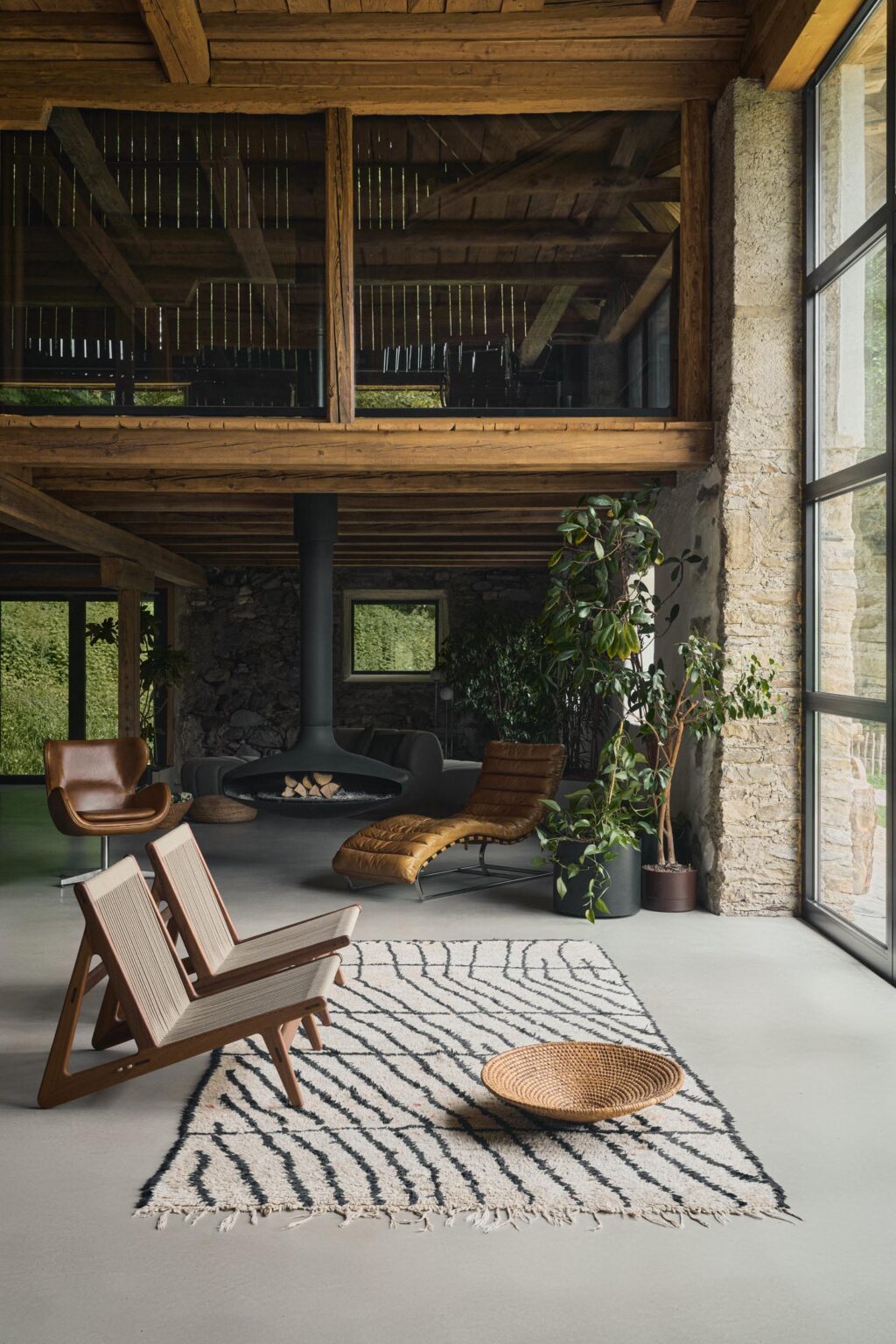 Two chairs looking out of an alpine retreat high up in the mountains