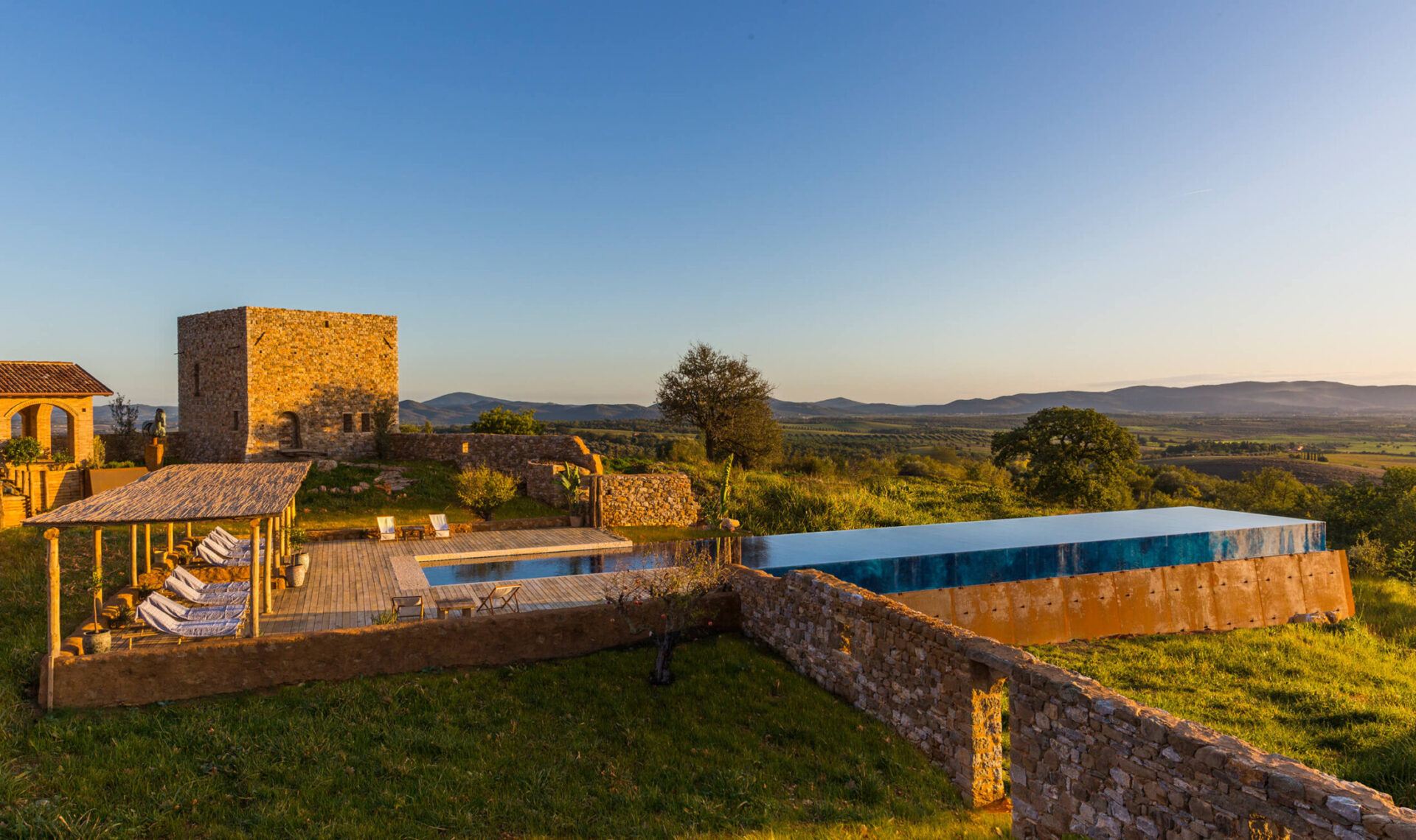 luxury villa in Tuscany with swimming pool at sunset