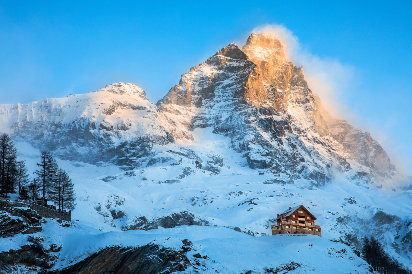 luxury italian ski chalet above corvine next to the matterhorn at sunset