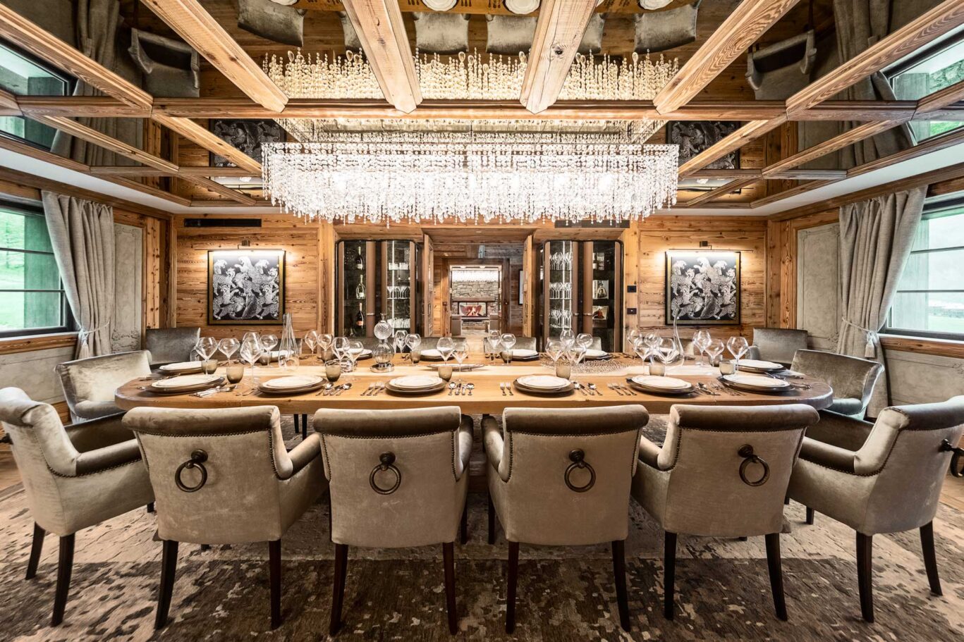 luxury italian ski chalet dining table with chandelier