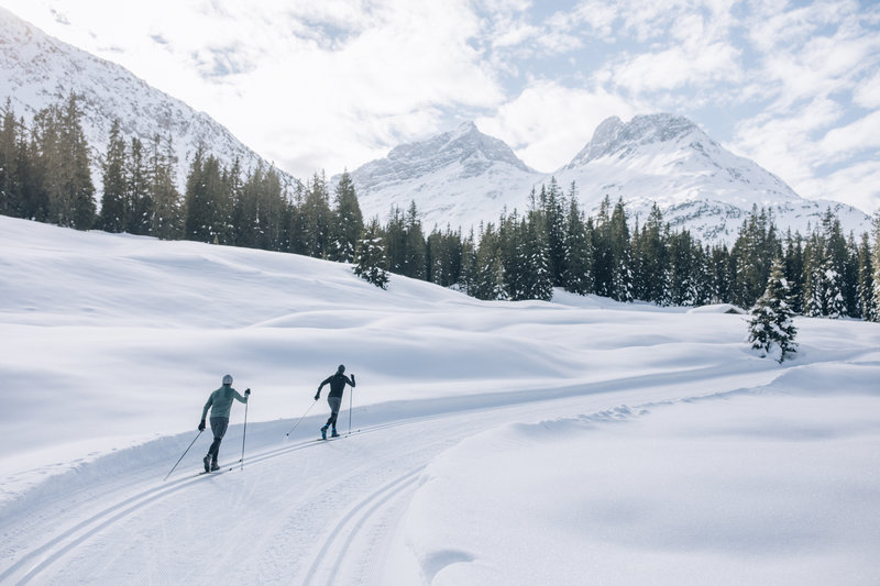 skiers skiing in lech on pristine snow