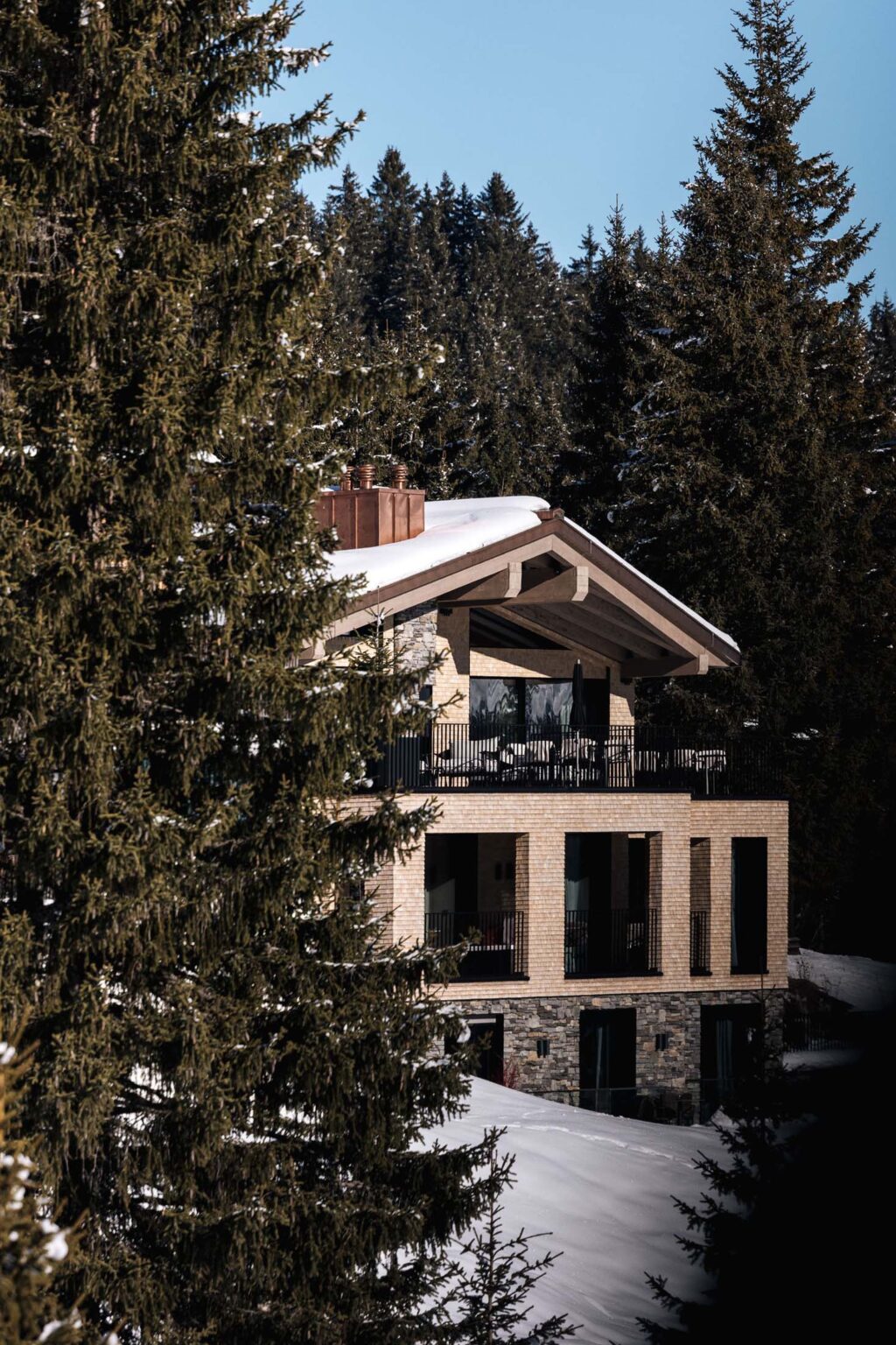 Hidden private chalet behind trees in lech