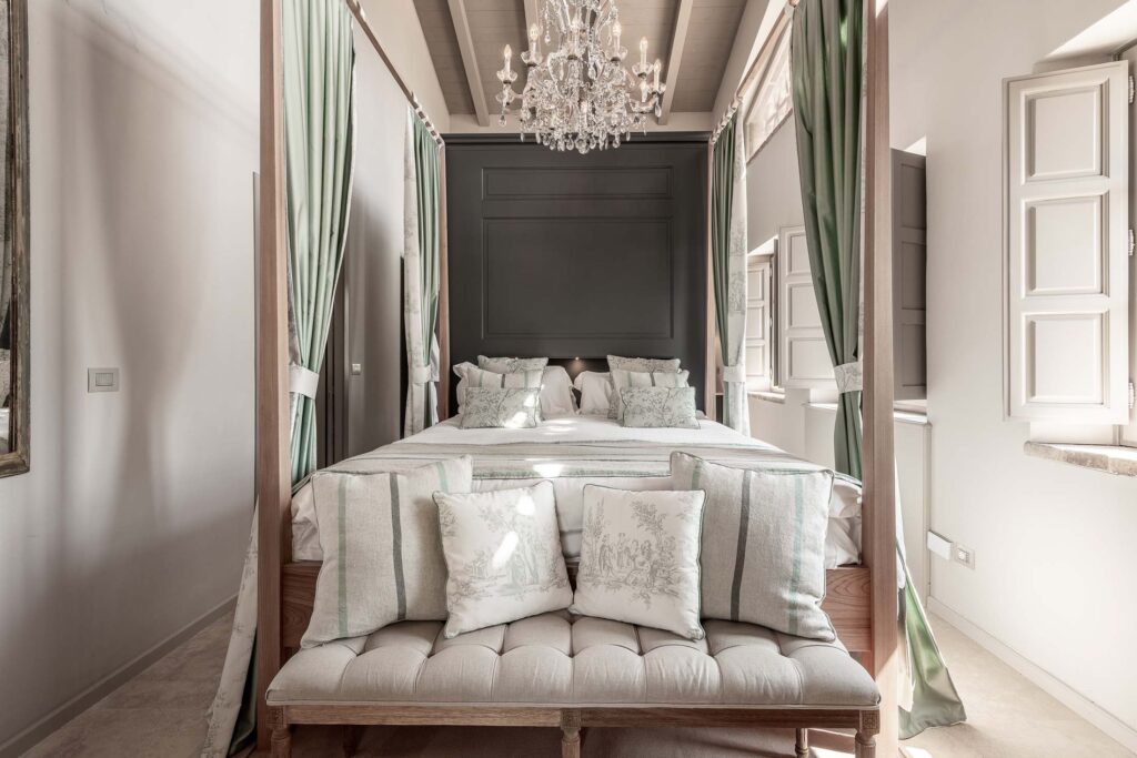 Luxury bedroom with four poster bed in Tuscany private villa