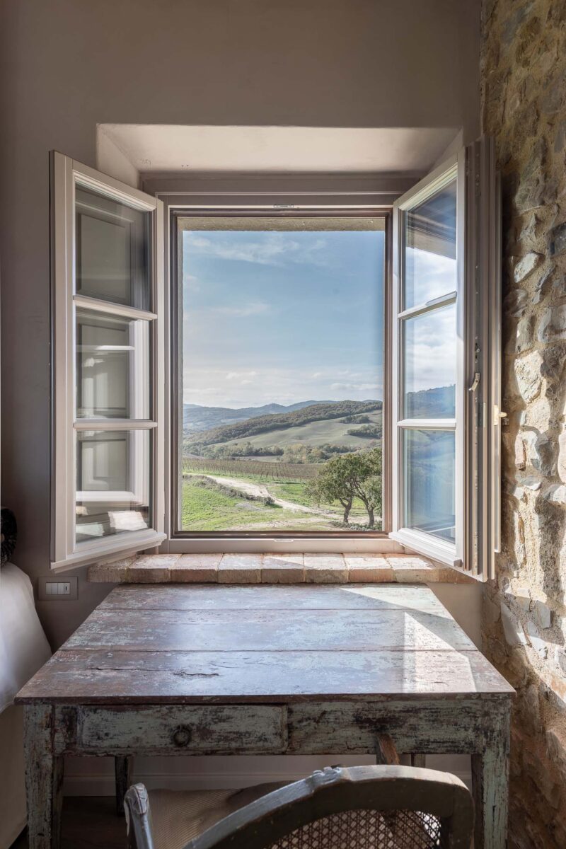 window view looking out to Tuscany hills