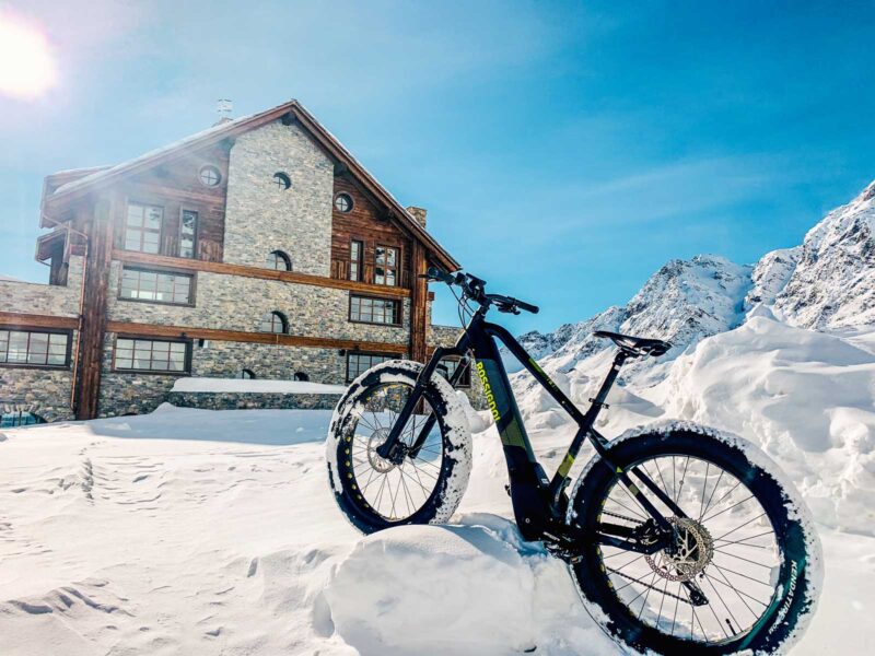 luxury italian ski chalet mountain biking in the snow