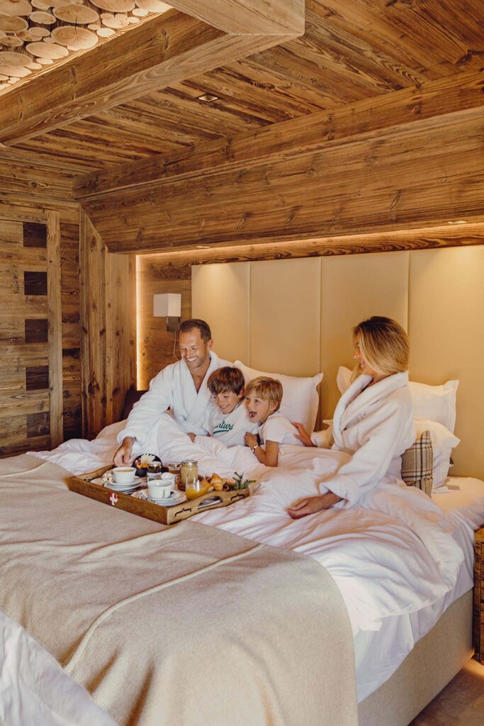 Family travel enjoying boring in bed in the three valleys France
