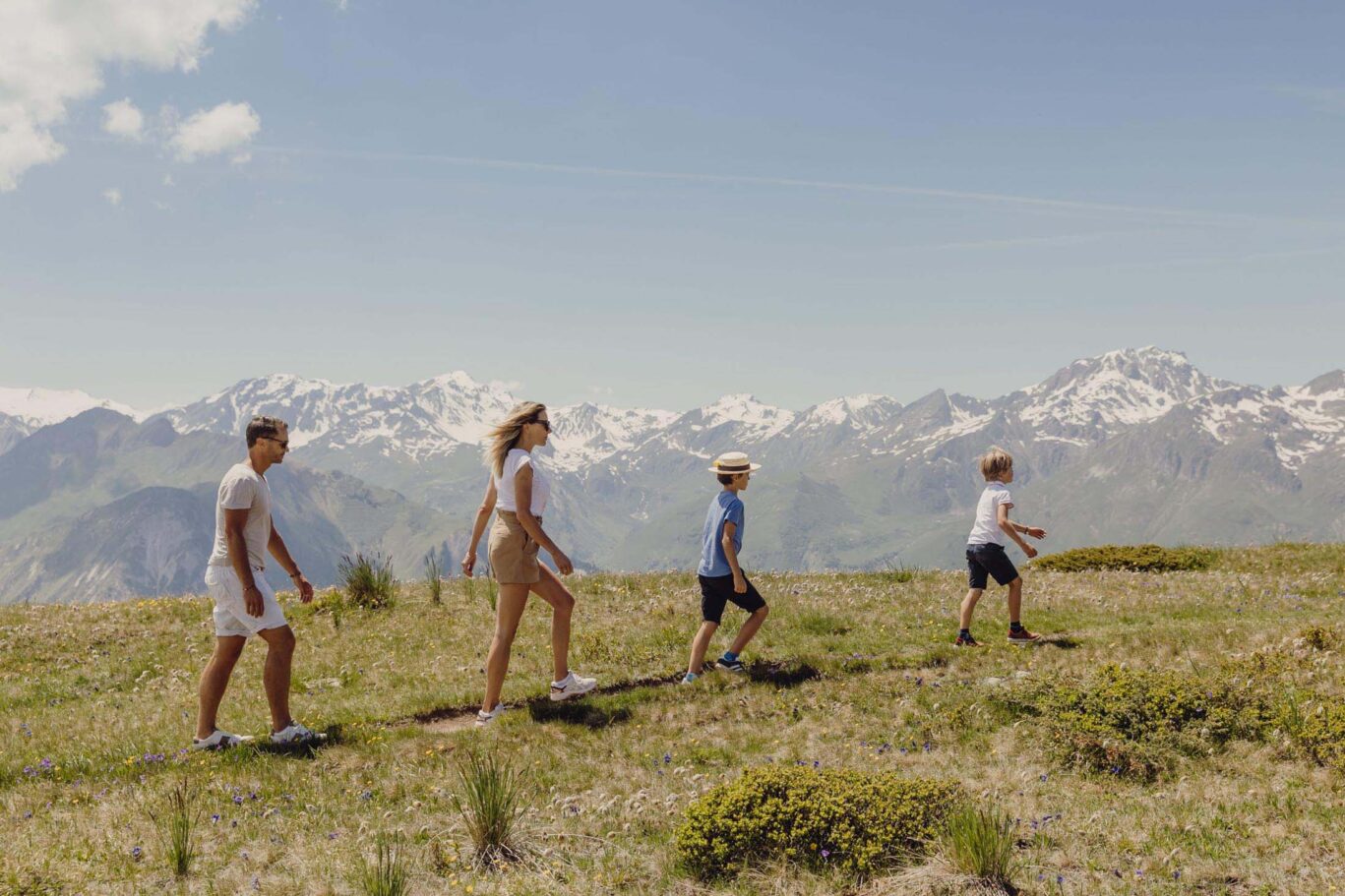 Family walking the three valleys French alps during summer
